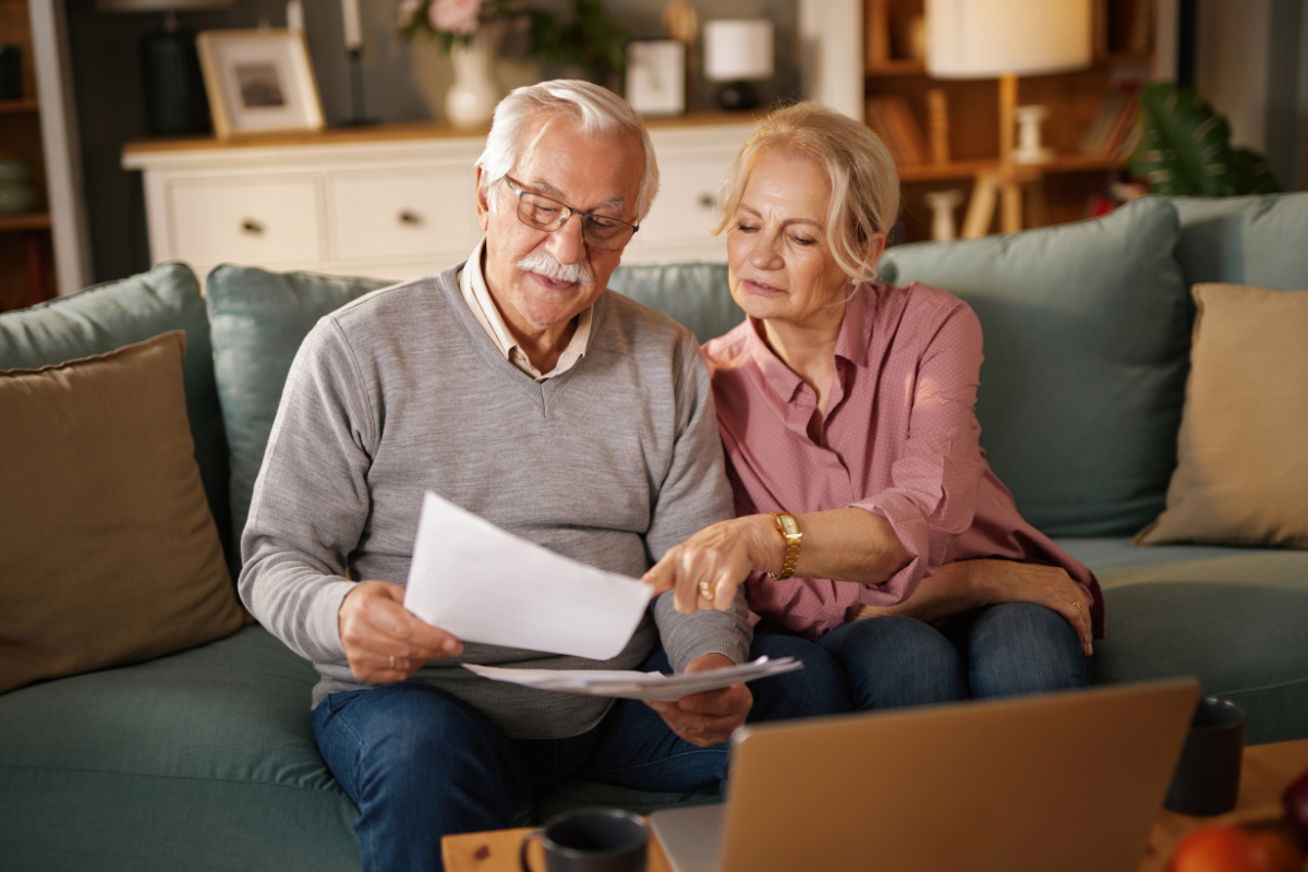 Senior couple reviewing document together